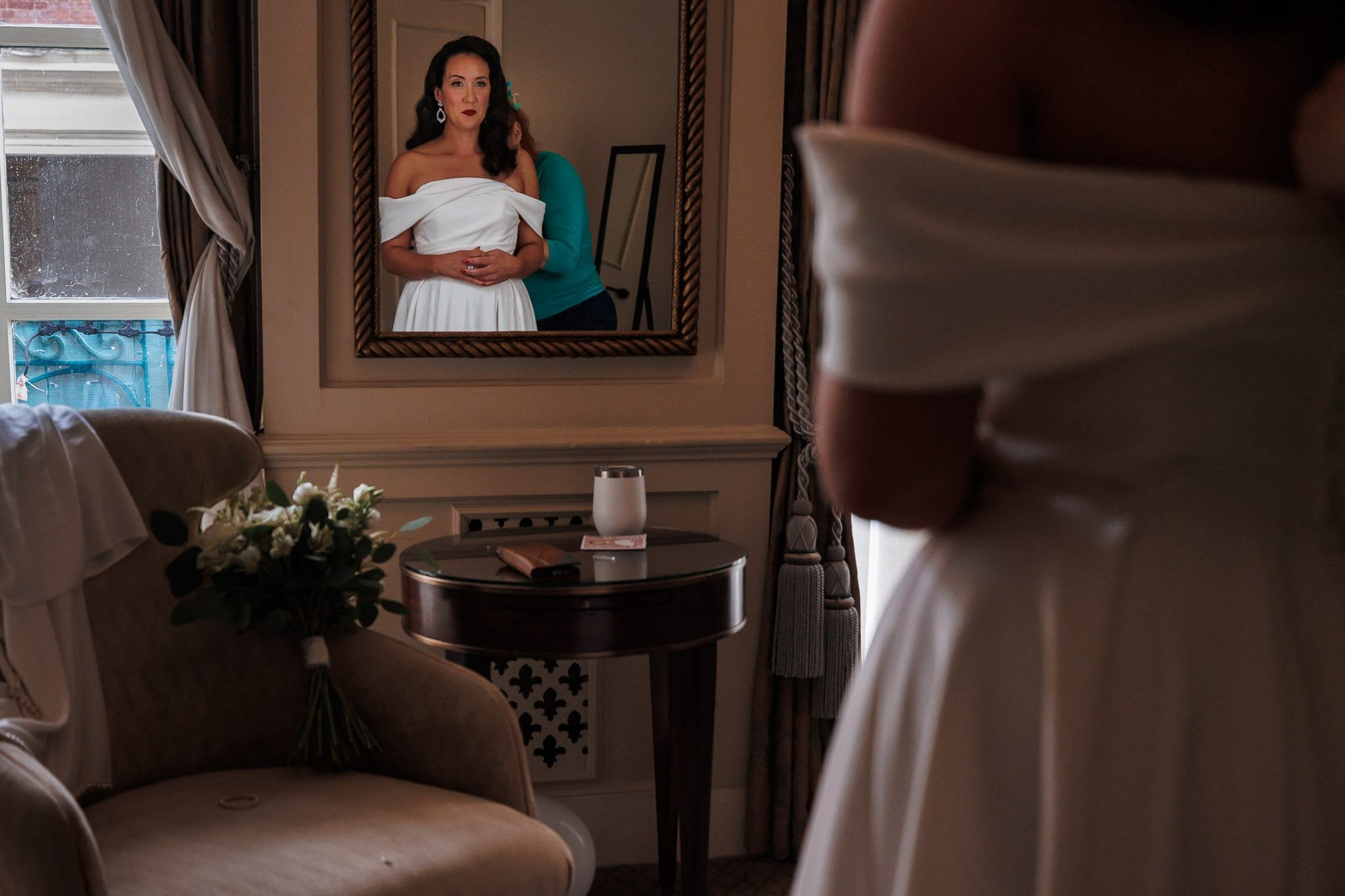 bride looking in mirror