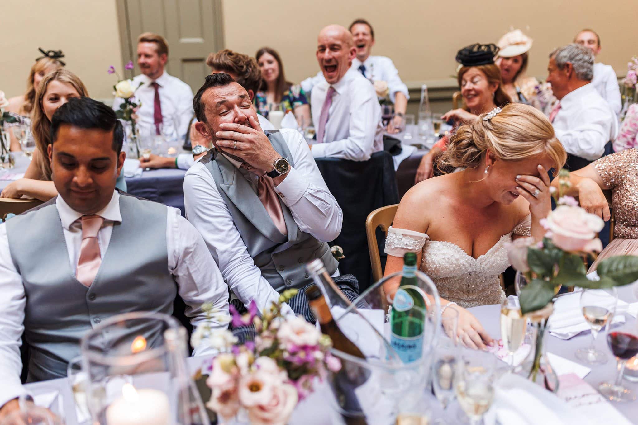 bride and groom in hysterics